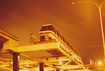Monorail train on Maintenance Facility Through Traverser at night thumbnail